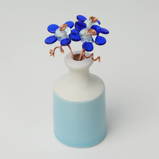 Mini ceramic bottle vase with blue glass 'Forever Flower' bouquet