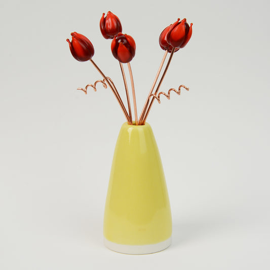 Miniature yellow porcelain cone vase with red glass tulips