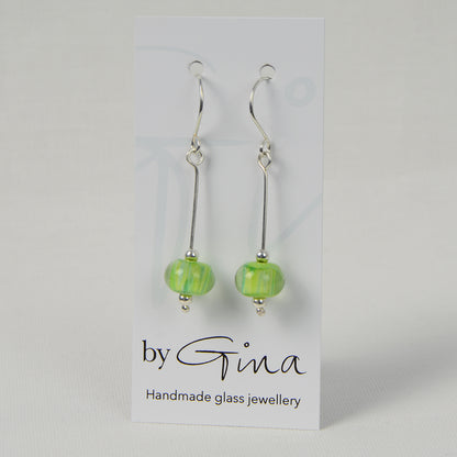 Encased green glass bead earrings